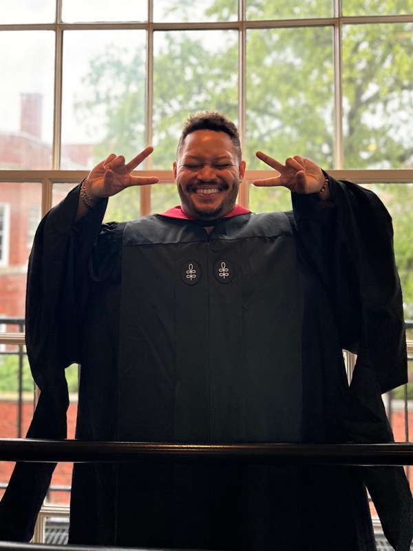 Ryan Robinson, Sensa Wellness founder, in Harvard graduation regalia